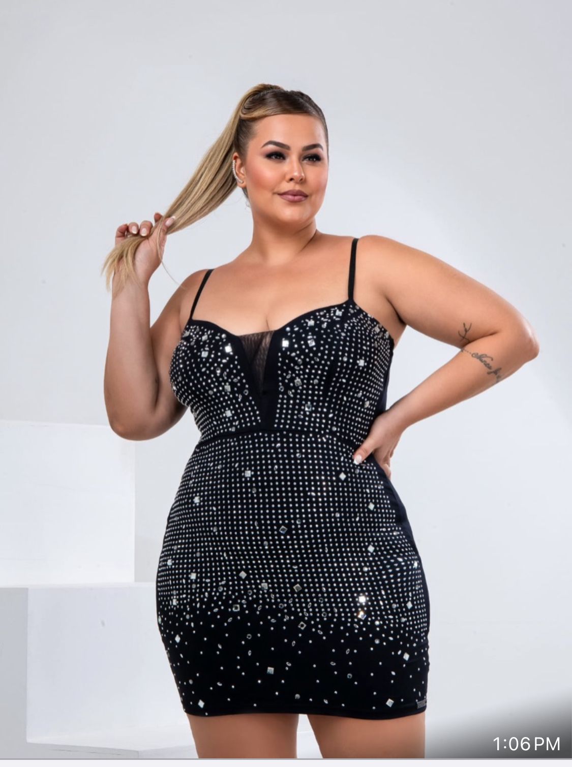 Black dress with shimmer, Lycra, and a curve-hugging fit